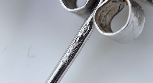 A pair of diamond stud earrings